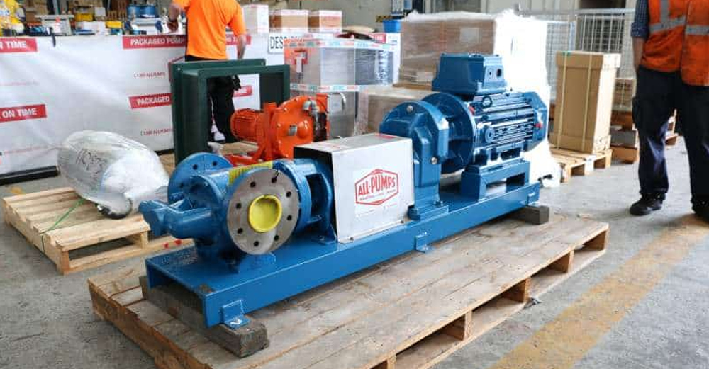 Blue industrial Tuthill pump assembly from ALL PUMPS on a pallet, designed for high volume oil transfer and petrochemical applications, including a large flange connection