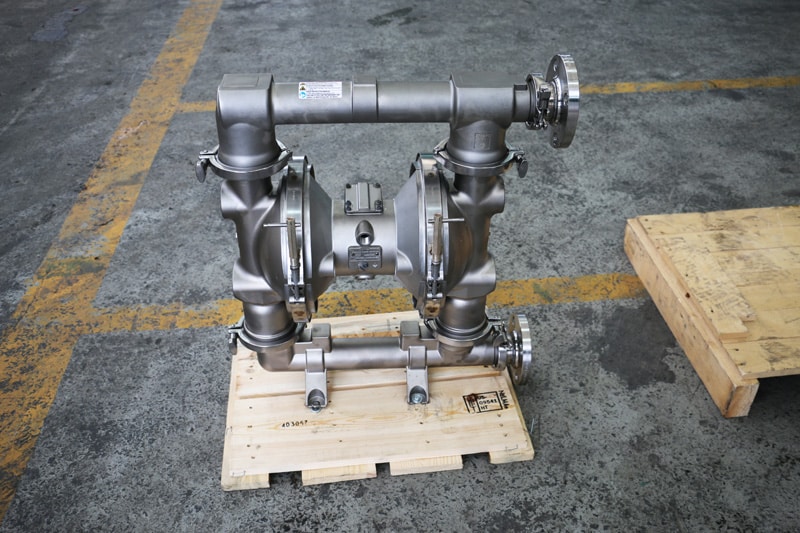 Stainless steel Graco Air-Operated Double Diaphragm (AODD) pump designed for sanitary and chemical applications, mounted on a wooden pallet ready for shipping
