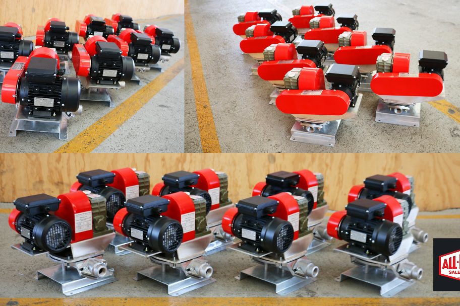 Batch of KDP electric diaphragm pumps with red and black motors on aluminum bases, ideal for industrial dispensing and transfer of petrol, diesel, and light oils