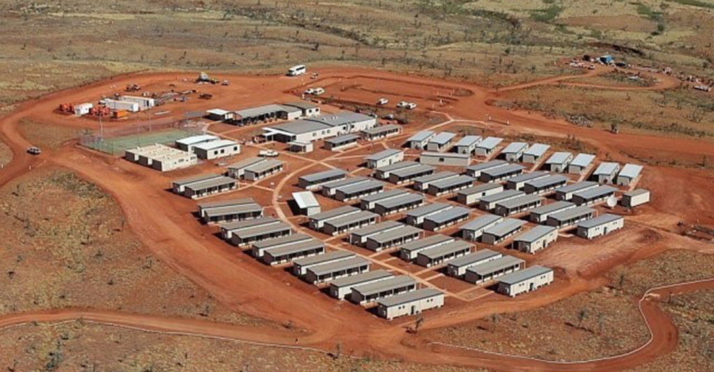 Aerial view of an organized mining camp or temporary industrial accommodation village, requiring packaged water treatment and wastewater infrastructure support systems