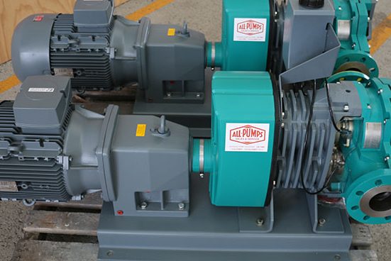 Close-up of two Netzsch T2 Tornado rotary lobe pumps coupled with grey electric motors, designed for reliable, gentle transfer of viscous or solid-laden fluids in wastewater or food processing