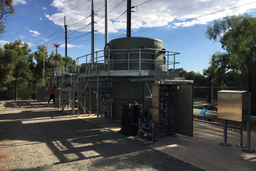Large outdoor industrial odour control system and chemical scrubbing unit at a wastewater treatment facility in South Australia with access platform and control panels