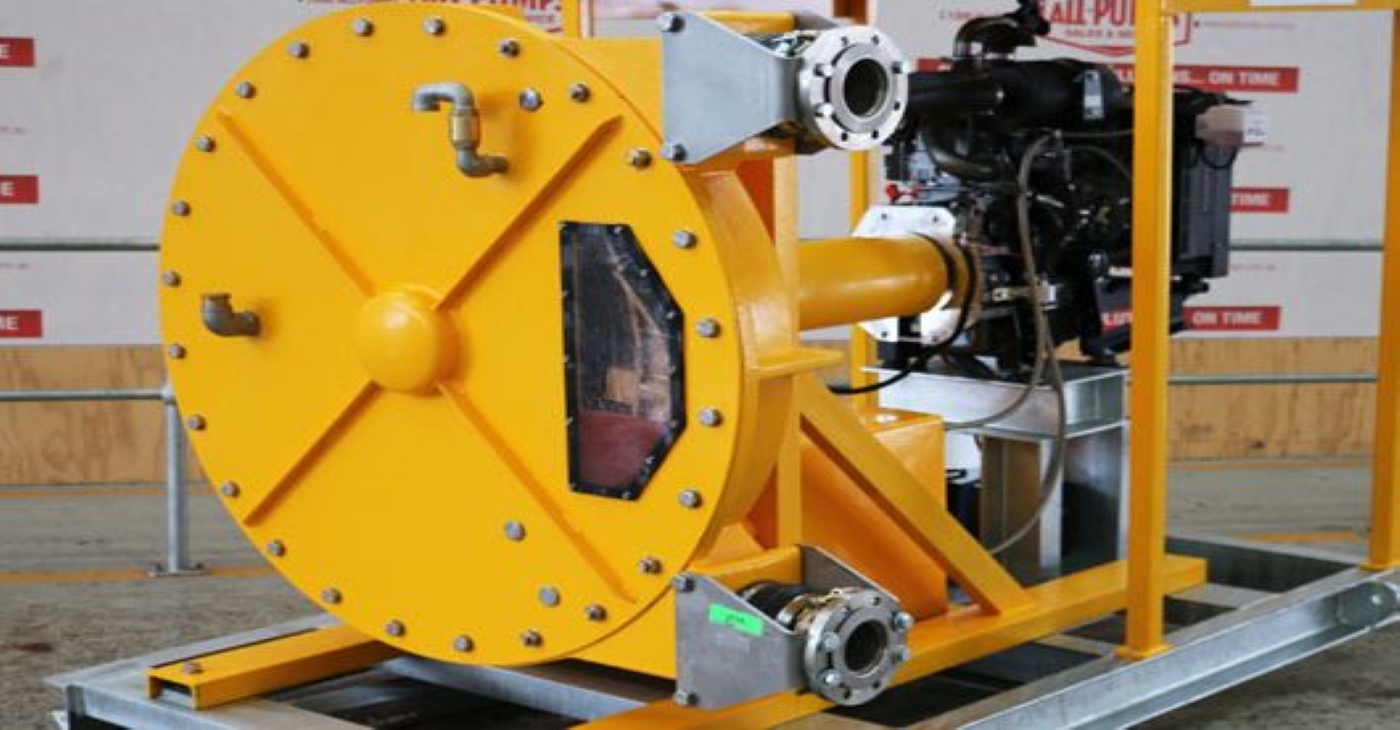 Large yellow diesel-driven peristaltic hose pump on a skid, engineered for high-pressure transfer of highly abrasive and viscous fluids like cement slurry in construction or mining
