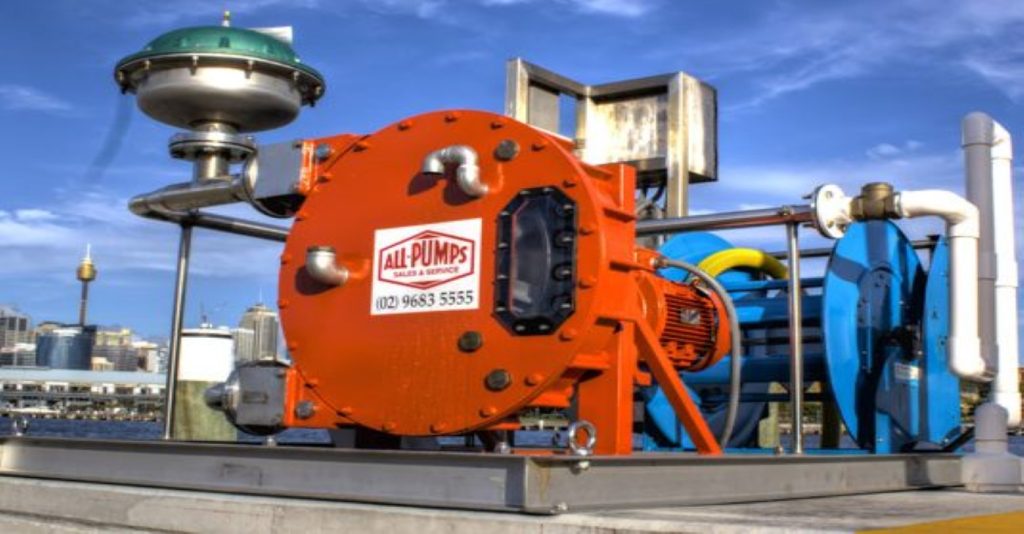 Industrial sewage pump out system for marine or dockside operations, featuring a large orange positive displacement pump from ALL PUMPS for reliable wastewater transfer