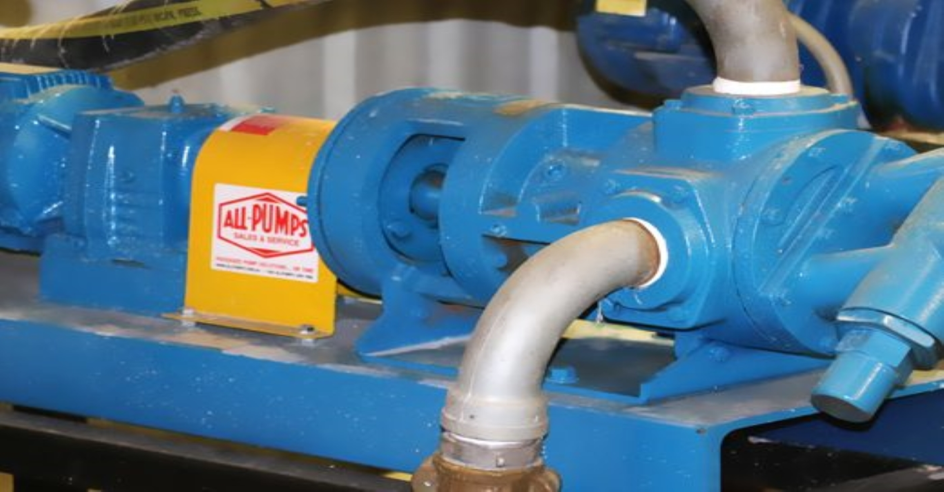 Close-up view of a Tuthill brand positive displacement gear pump suitable for high-viscosity fluid transfer, such as starch, syrups, or other sanitary food-grade media