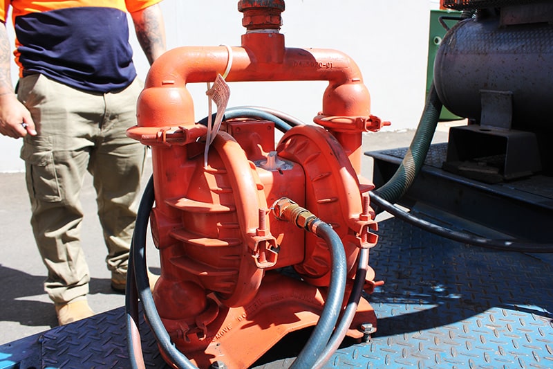 Wilden P4 metal air-operated double diaphragm pump (AODD) used for portable, heavy-duty slurry and industrial fluid transfer on a worksite