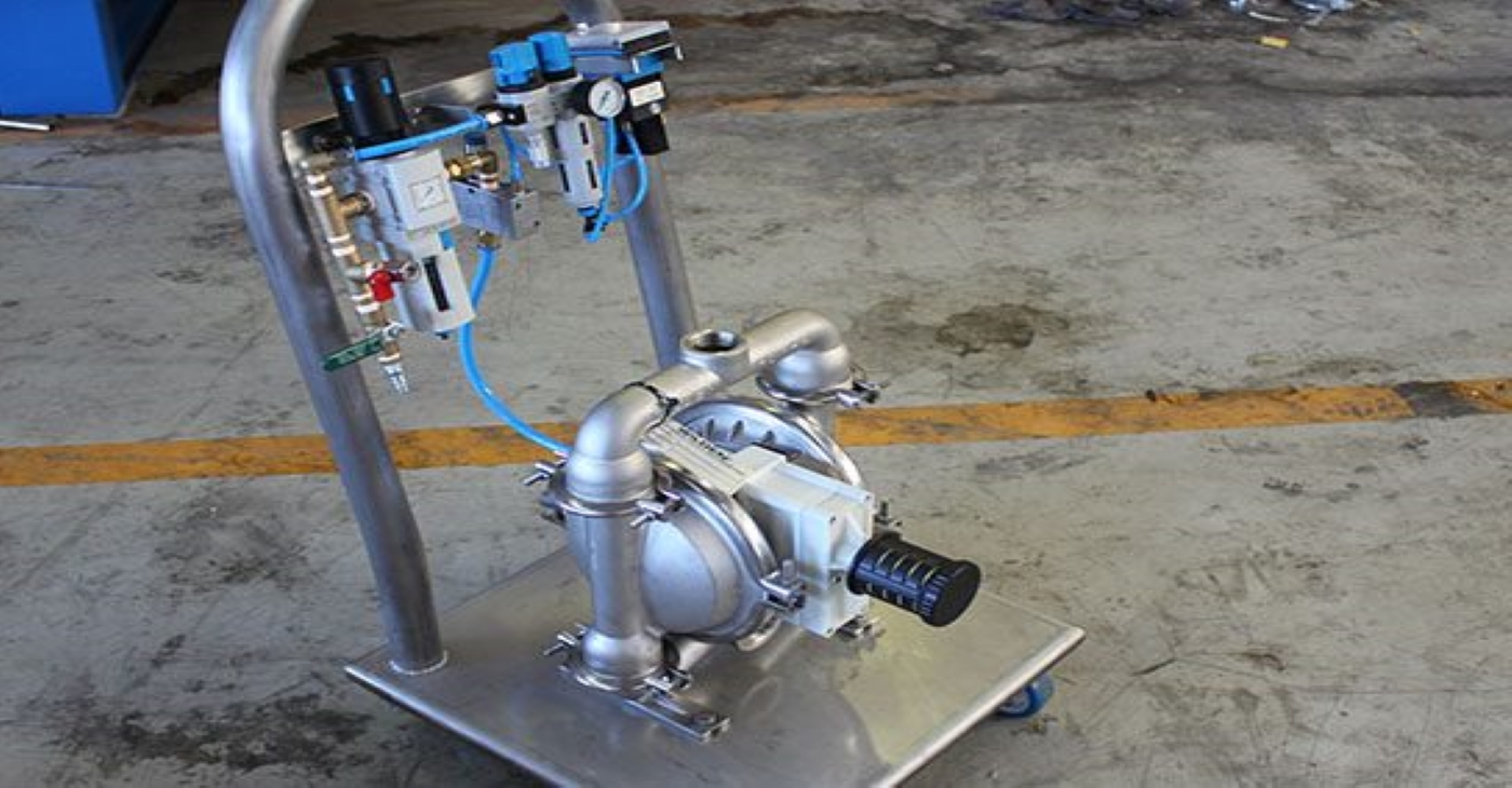 Wilden P4 Air-Operated Double Diaphragm (AODD) pump constructed of stainless steel and mounted on a mobile sanitary cart with air controls, ideal for food-grade or clean chemical transfer