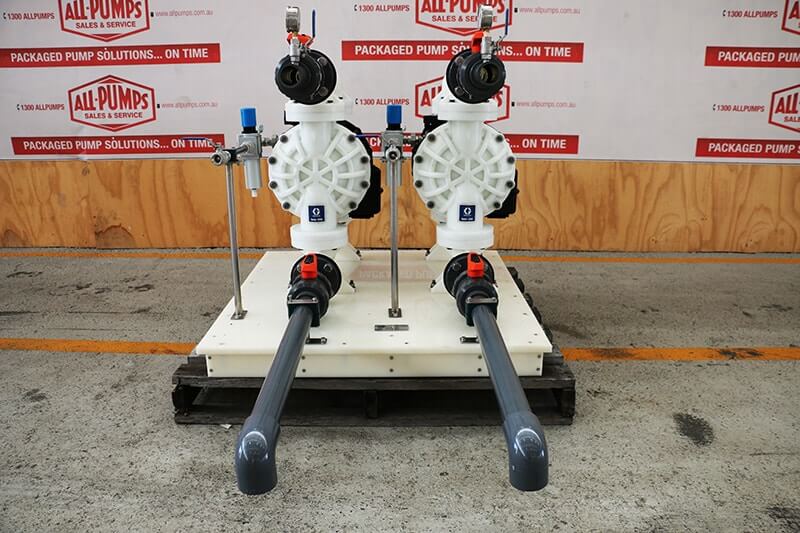 Duplex Graco Husky 2200 AODD pumps system constructed of white polypropylene, custom-piped for high-volume transfer and injection of corrosive sea water or industrial chemicals