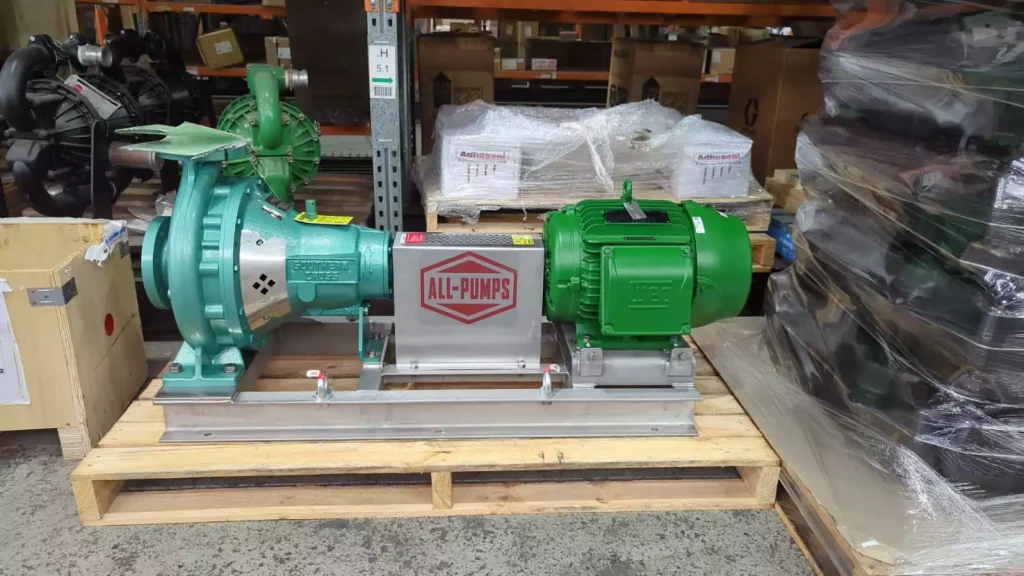 Bright green and red centrifugal pump set from ALL-PUMPS with an electric motor on a steel base, intended for chilled water circulation in commercial HVAC and large-scale cooling systems