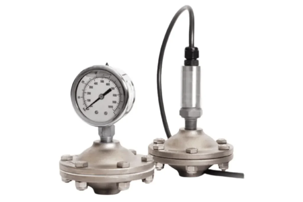 Pressure gauge and tubing beside a metallic fitting
