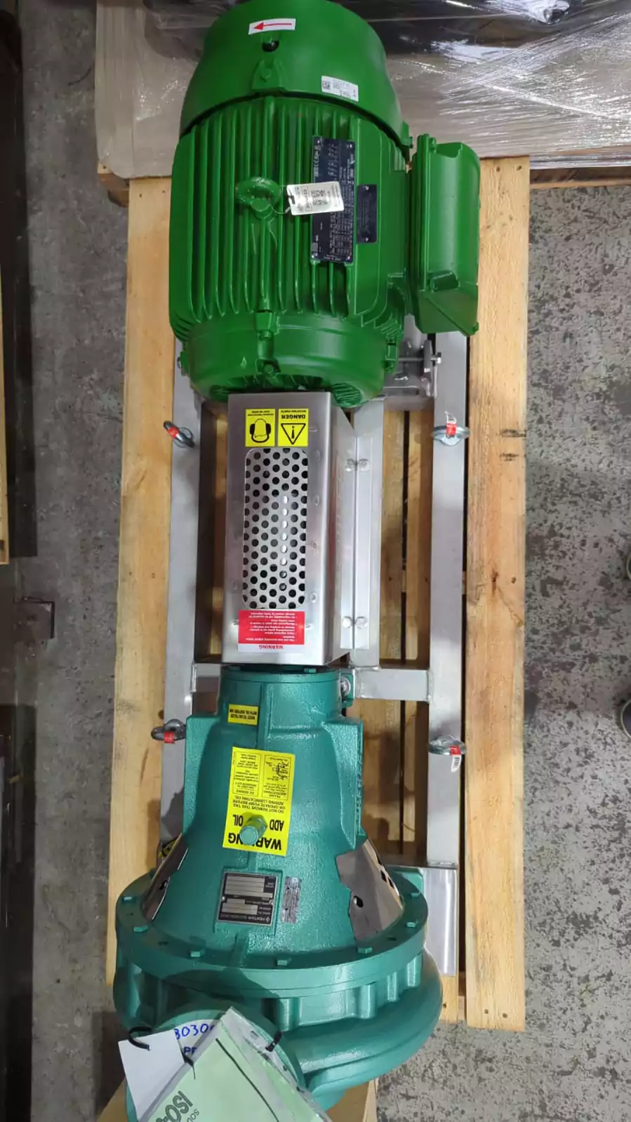 Green chilled water circulation pump in a plant room