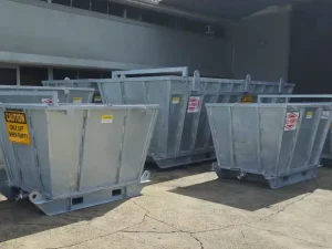 Several gray tank units inside a warehouse