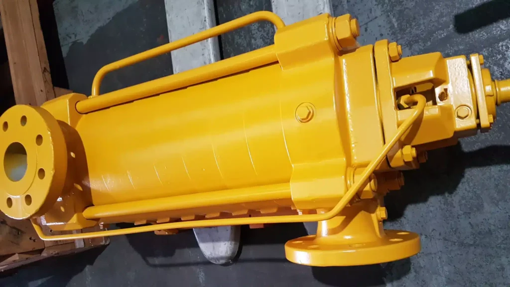 Close view of a yellow mining pump frame