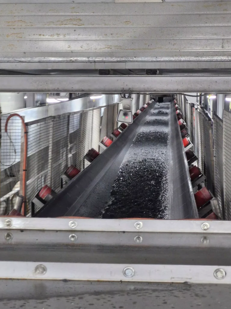 Long conveyor in an underground tunnelling facility