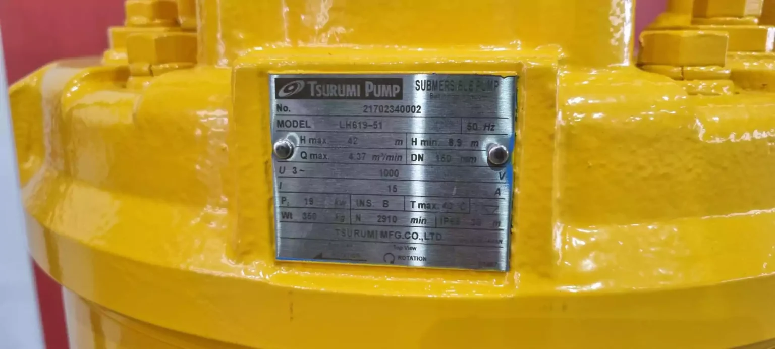 Close view of specification plate on a yellow Tsurumi pump