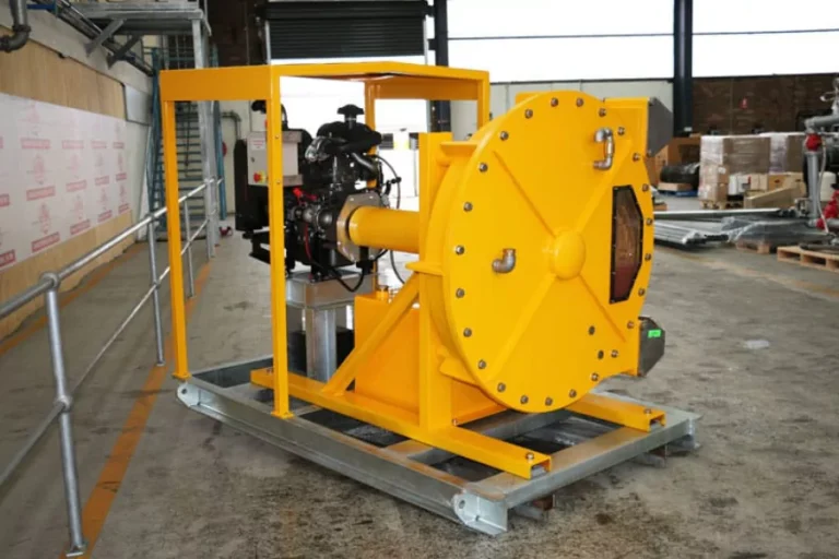 Yellow industrial pump equipment inside a frame