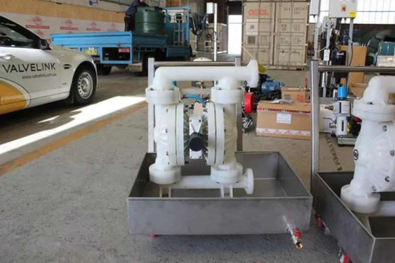 White pump assembly on a metal skid outdoors