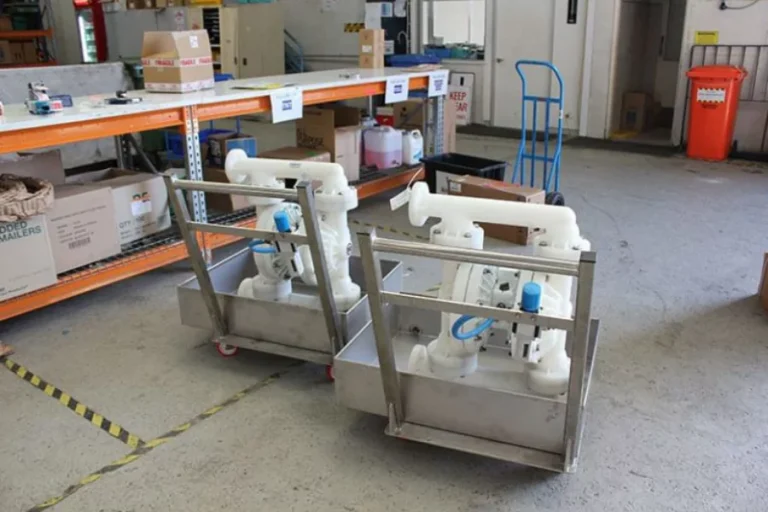 White industrial pump assembly on a metal skid