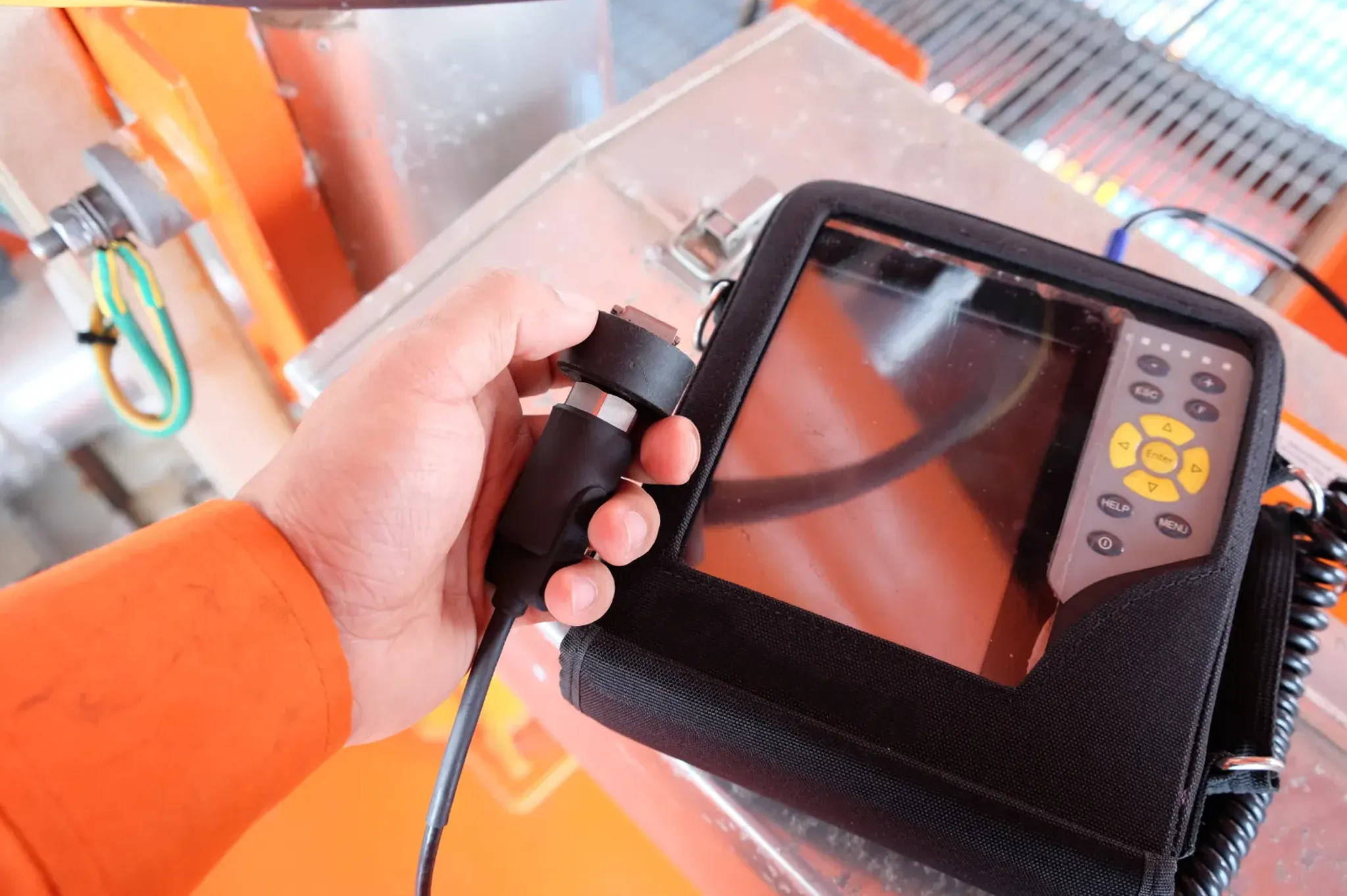Hands holding a vibration measurement device