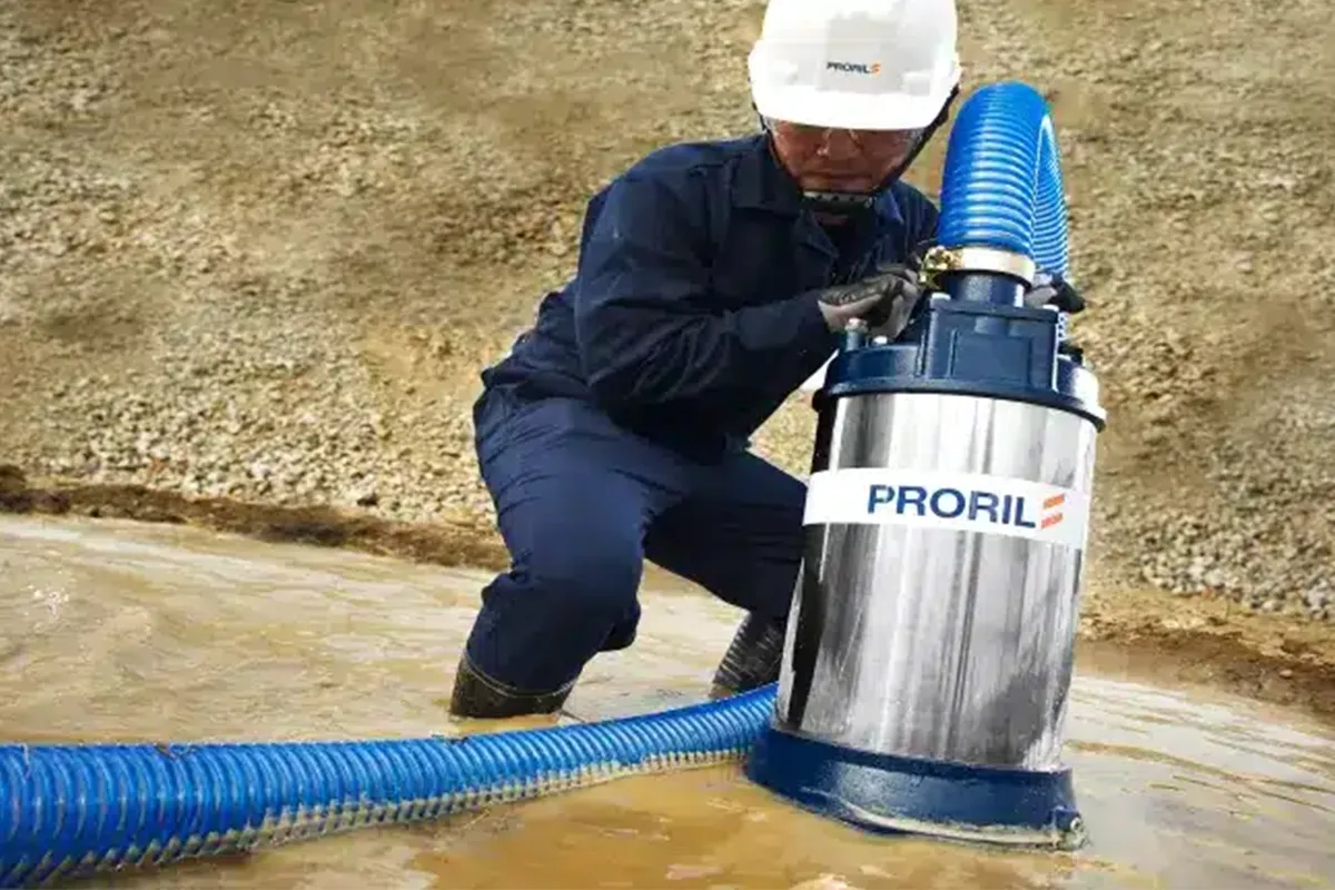 Worker handling a Proril submersible pump
